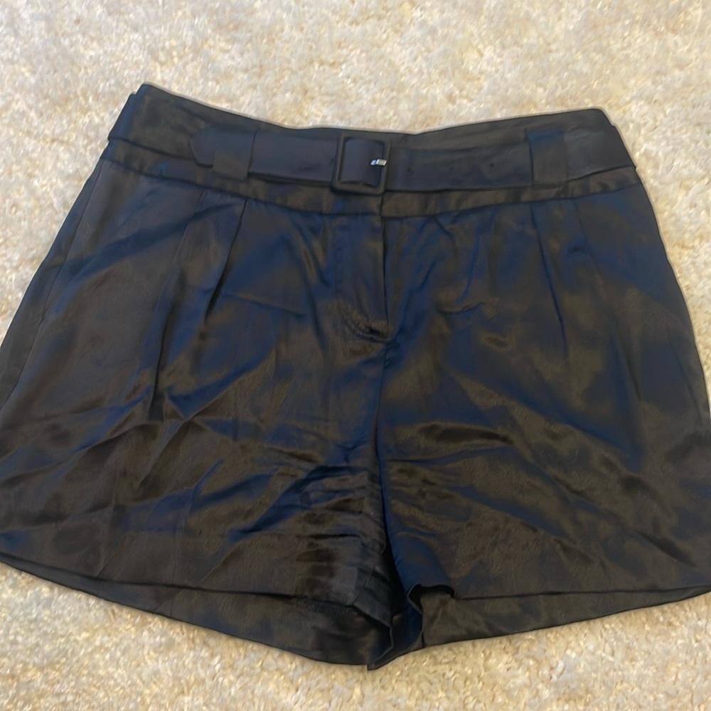 Black pleated 93% silk 7% spandex shorts with detachable belt.